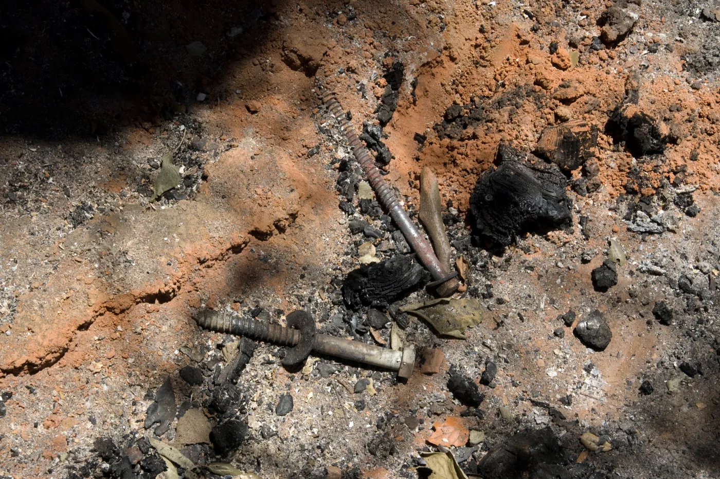ash and burned ramains of a wooden bench after the Jesusita Fire