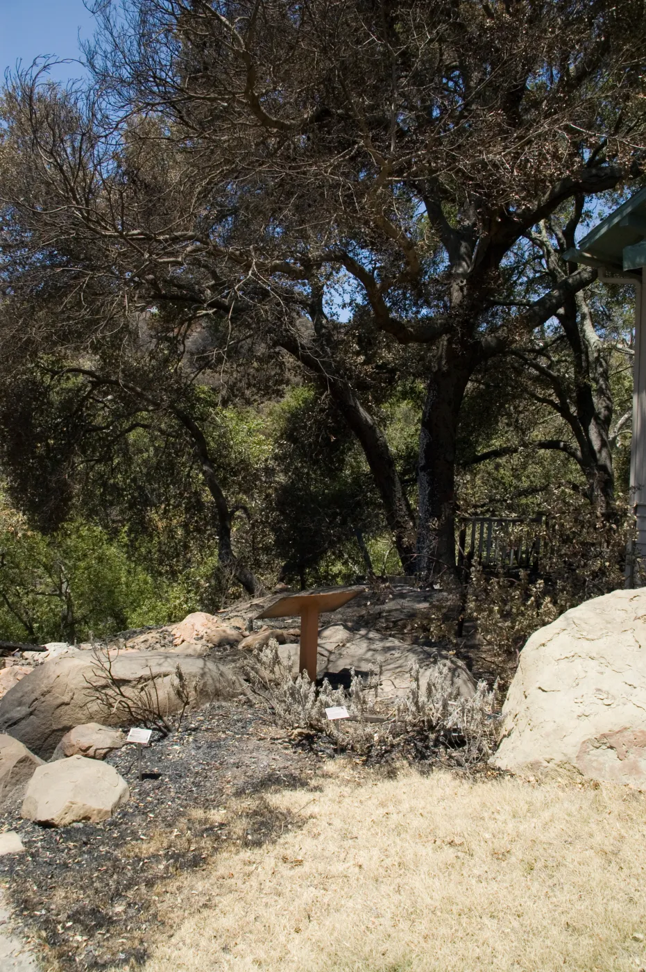 burned wood deck along canyon rim, adjacent to cottage, after the Jesusita Fire