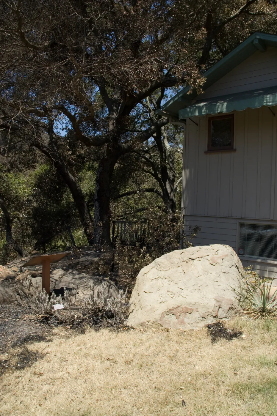 burned wood deck along canyon rim, adjacent to cottage, after the Jesusita Fire