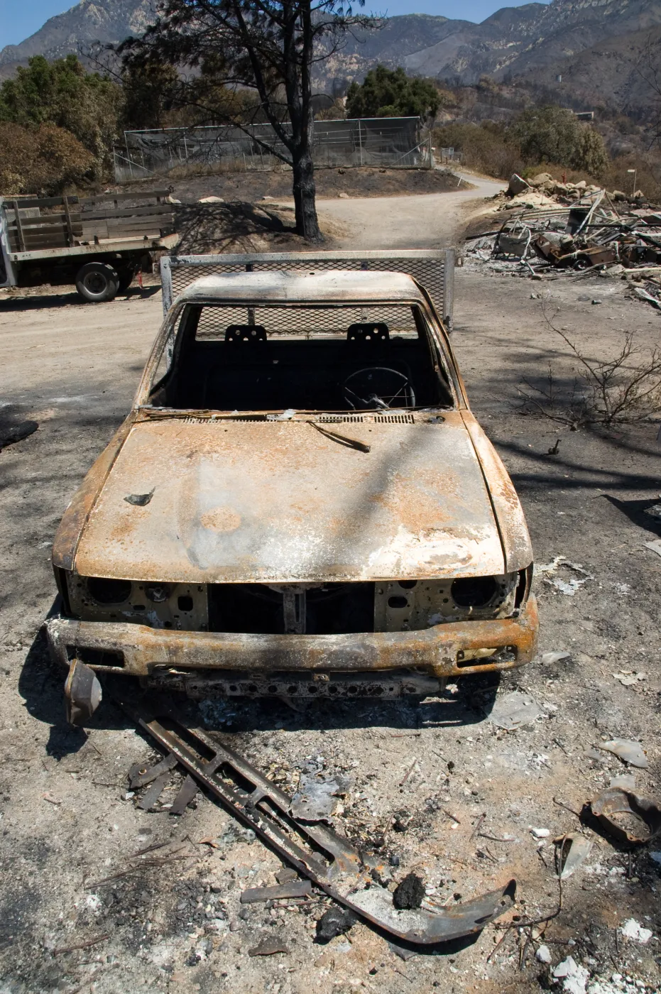 burned trucks parked at Gane House after the Jesusita Fire