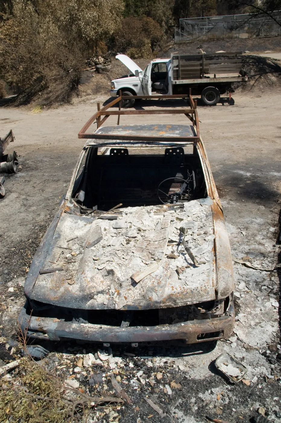 burned trucks in front of Gane House after the Jesusita Fire