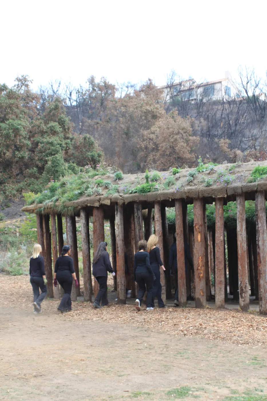 Art from the Ashes, dancers with Herb Parker's â€˜Haven' labyrinth sculpture