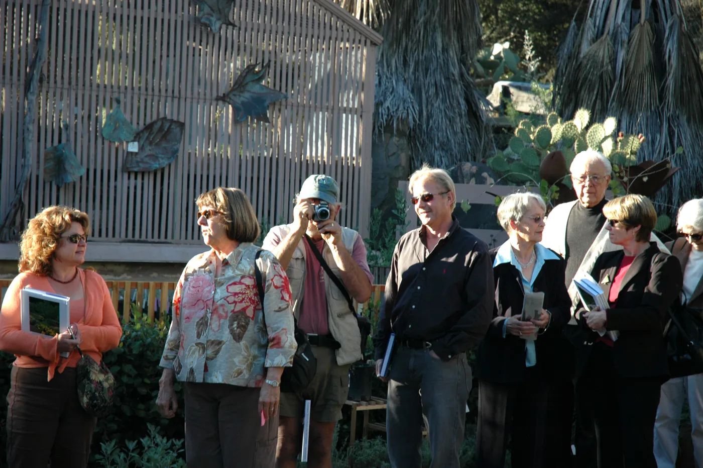 people in line for Carol Bornstein book signing, Geege Ostroff (camera) and Dave Kershaw
