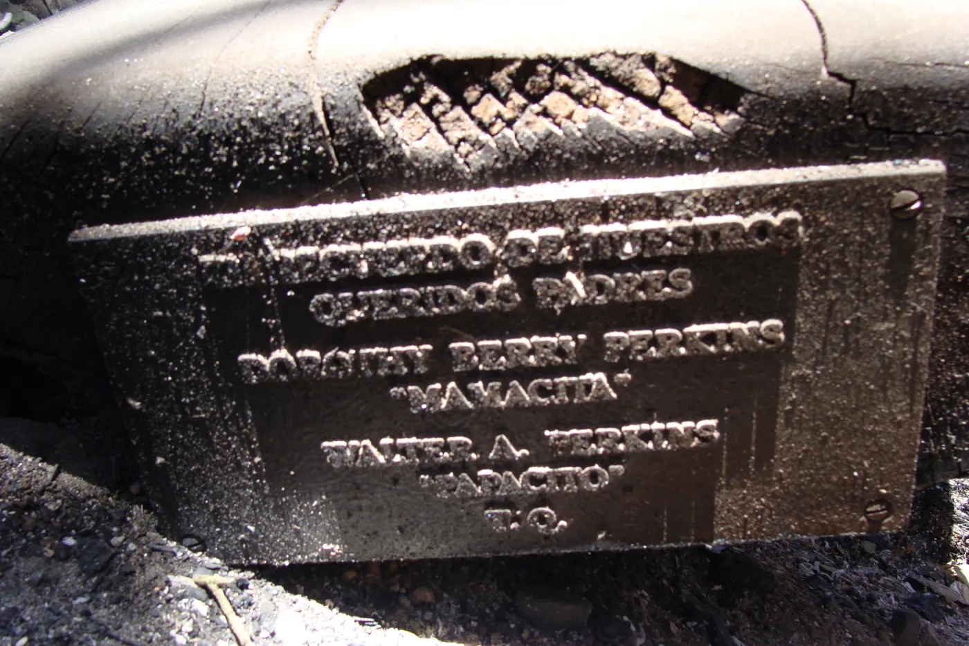 burned wood bench and dedication plaque, after the Jesusita Fire