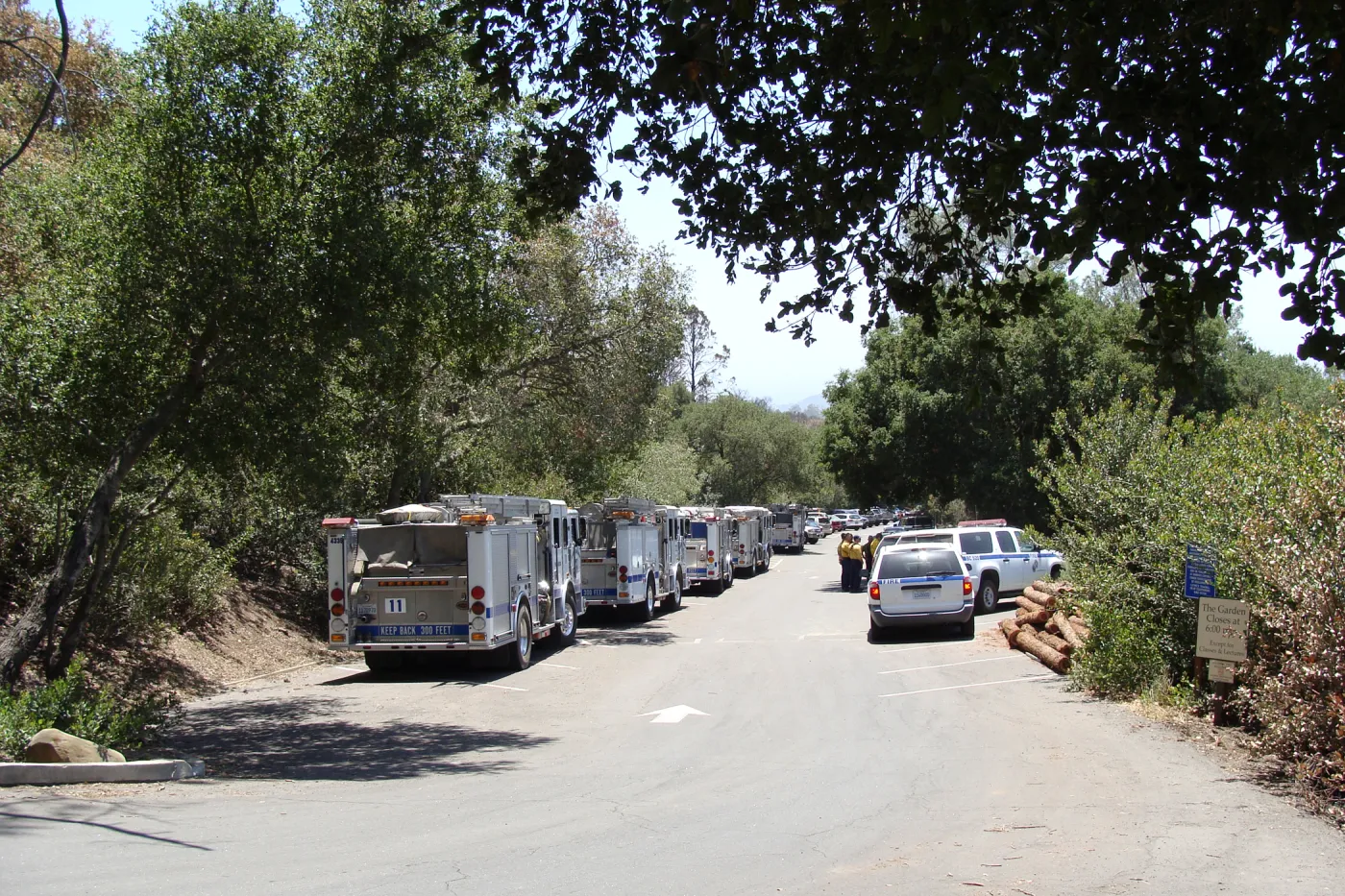 Parking lot with Santa Barbara fire vehicles and firefighters at the Santa Barbara Botanic Garden, after the Jesusita Fire