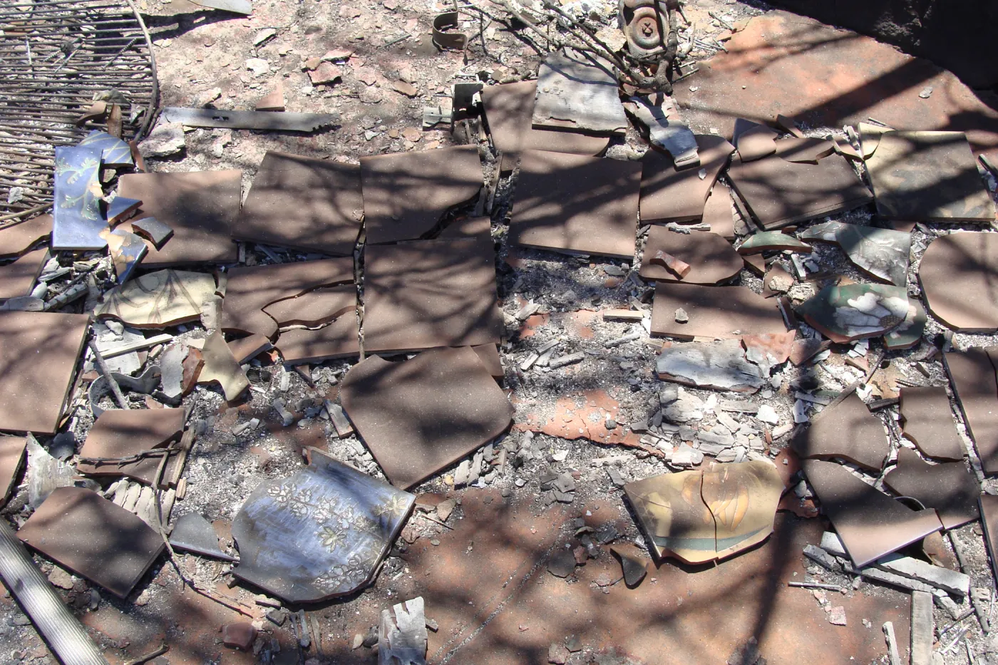 burned debris and broken decorative clay tiles, at the Gane/Lotterhos site, after the Jesusita Fire