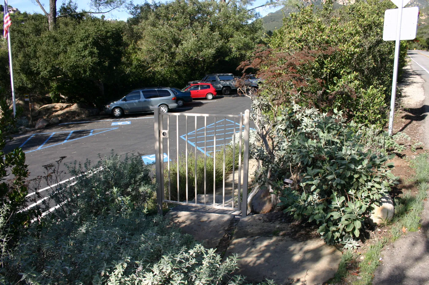 metal gate between Mission Canyon Road and the parking lot