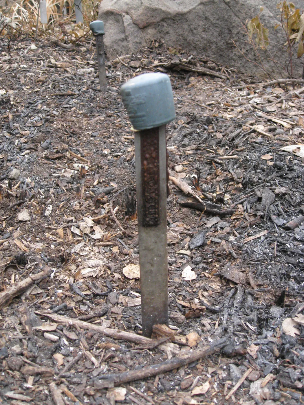 accession stake, damaged signs and public information labels after the Jesusita Fire