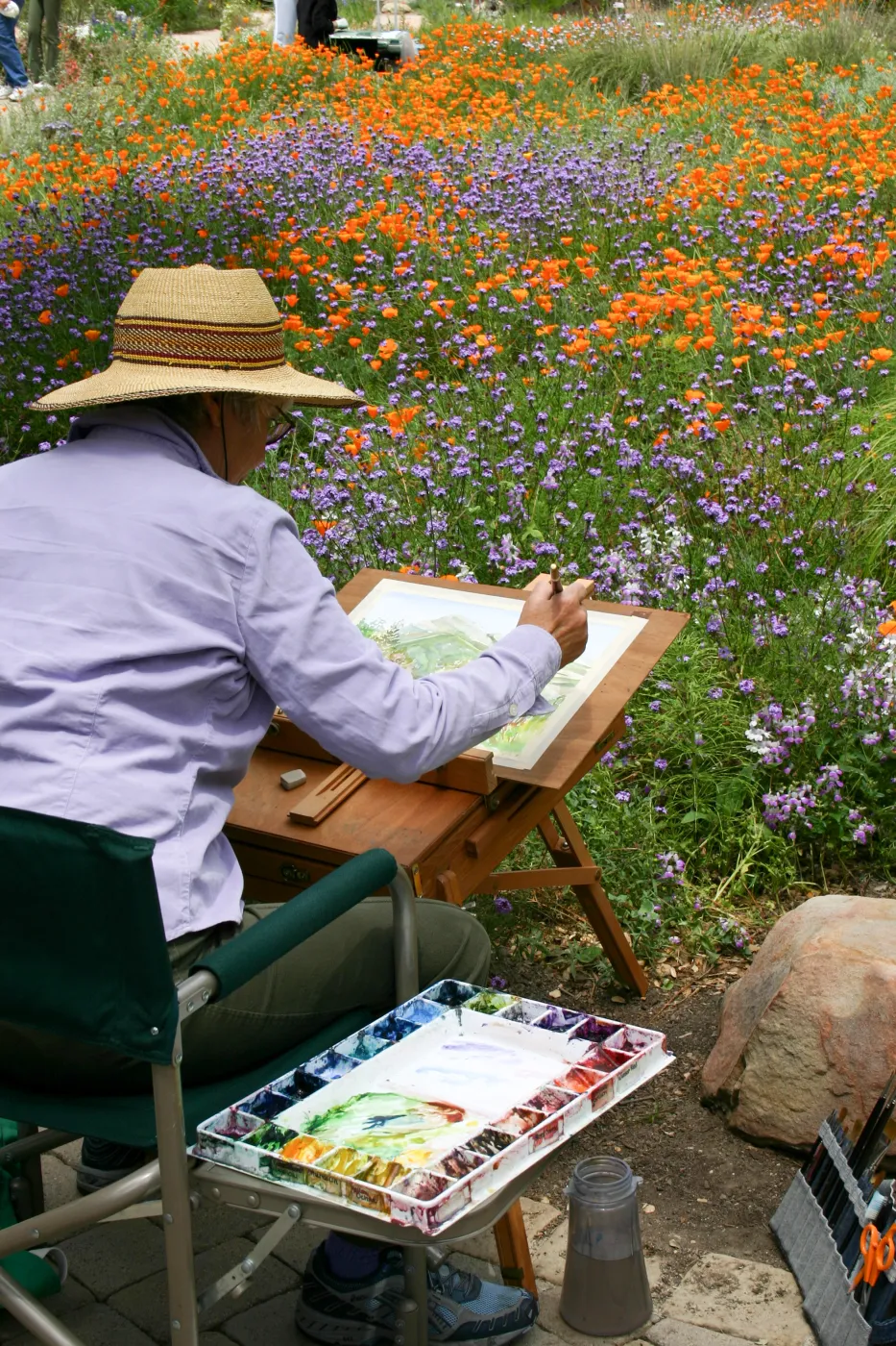 SBBG Entrance, artist painting in the Garden