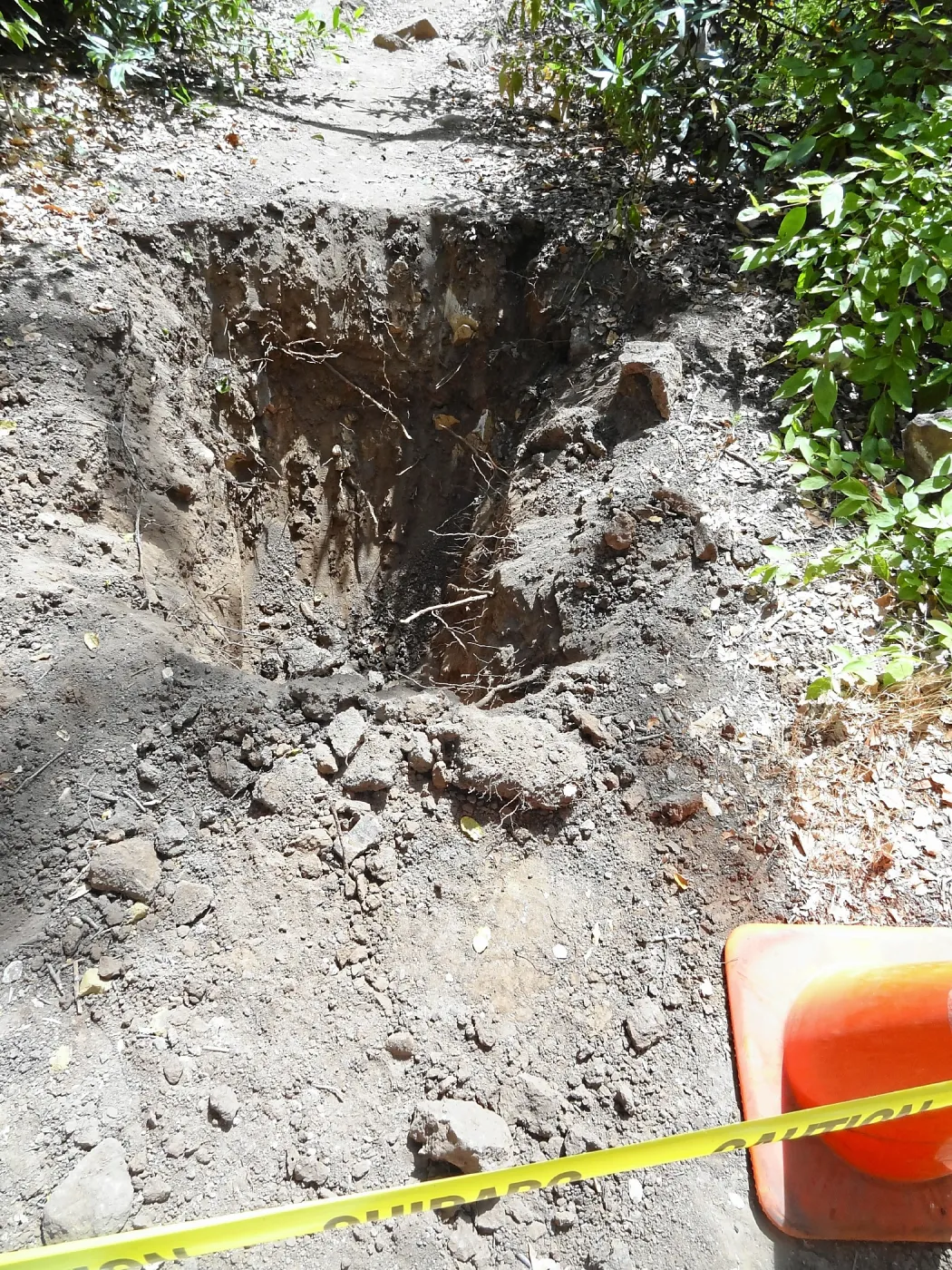 Test pit dug for soil compaction analysis, west side of Campbell Bridge