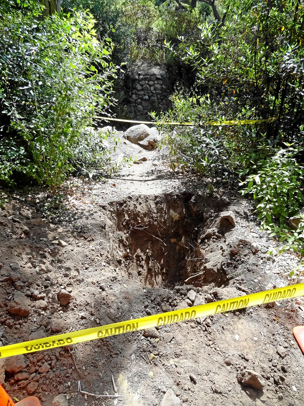 Test pit dug for soil compaction analysis, west side of Campbell Bridge