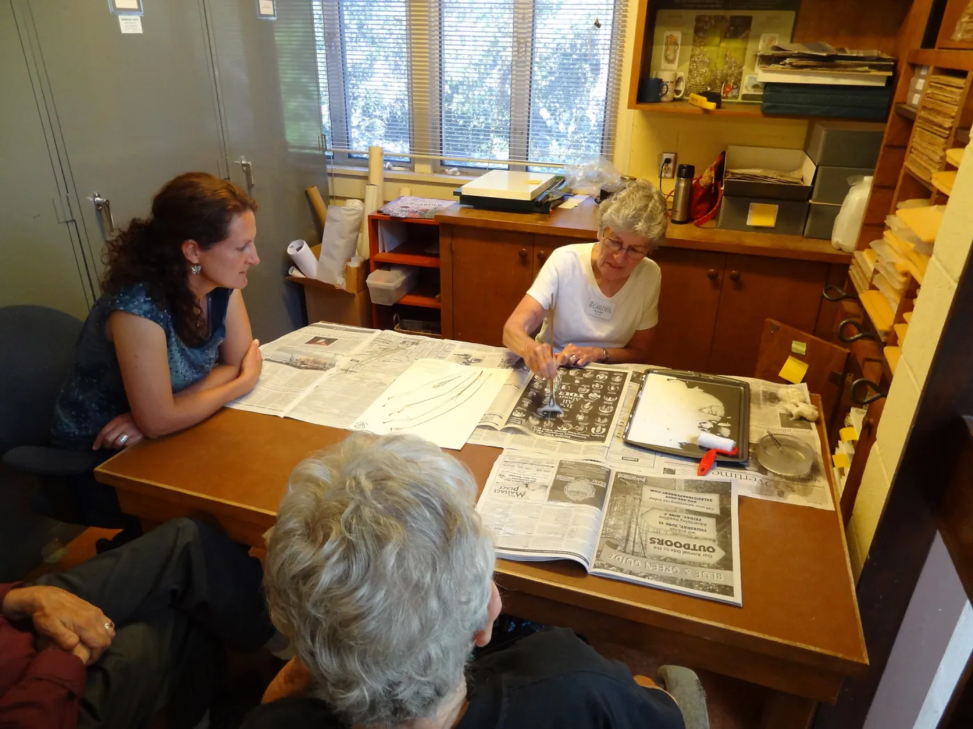 Ky Easton, Herbarium volunteer, mounting herbarium specimens, Denise Knapp