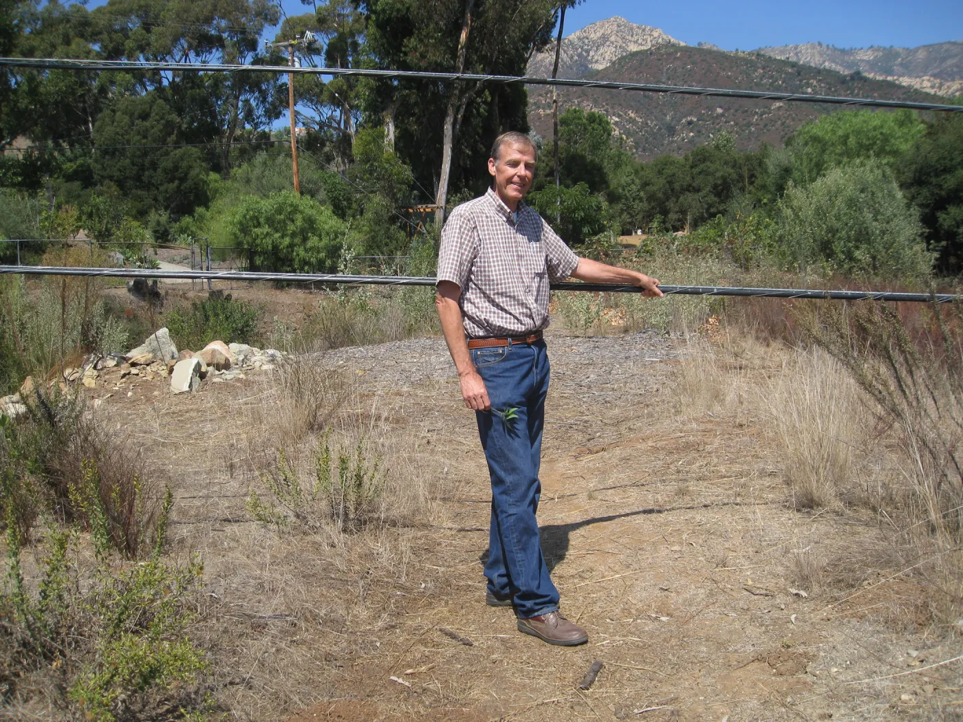 Bob Muller with sagging power lines at Tunnel Road gate