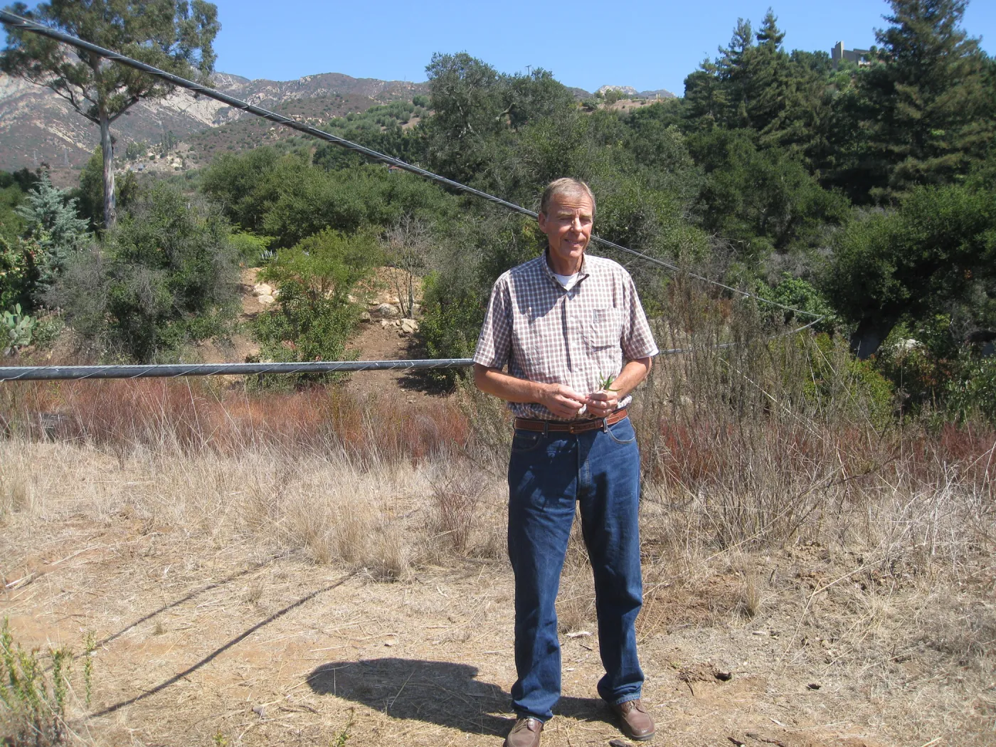 Bob Muller with sagging power lines at Tunnel Road gate
