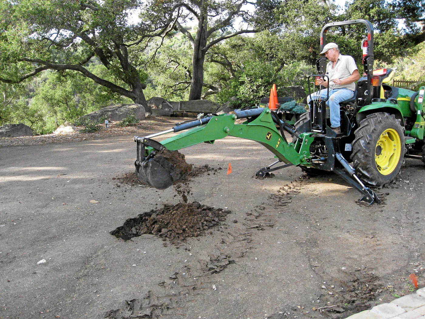 Dave Kershaw digging holes for new oak trees in the Meadow Oaks
