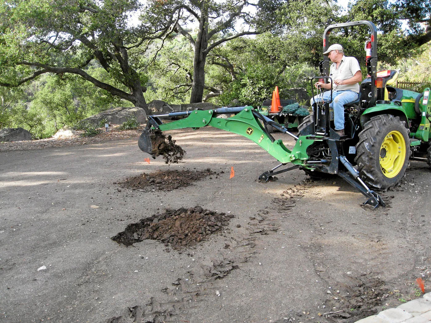 Dave Kershaw digging holes for new oak trees in the Meadow Oaks