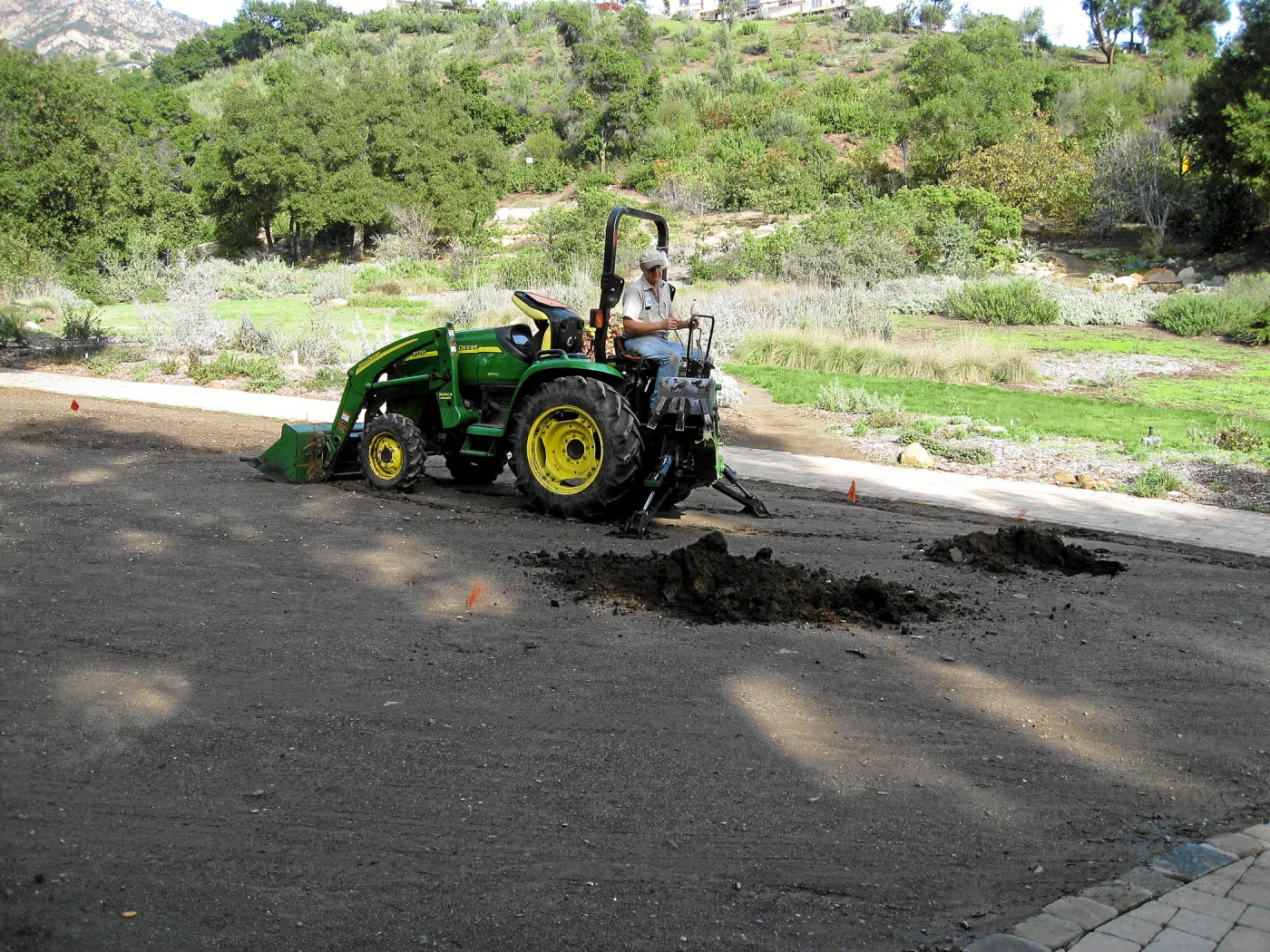 Dave Kershaw digging holes for new oak trees in the Meadow Oaks