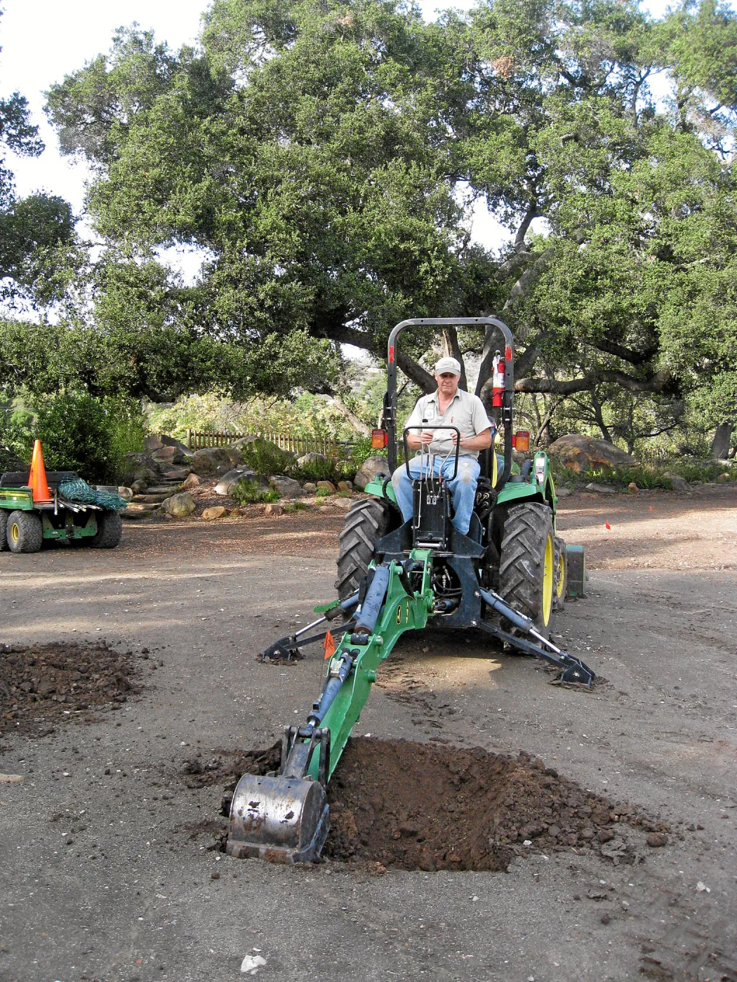 Dave Kershaw digging holes for new oak trees in the Meadow Oaks