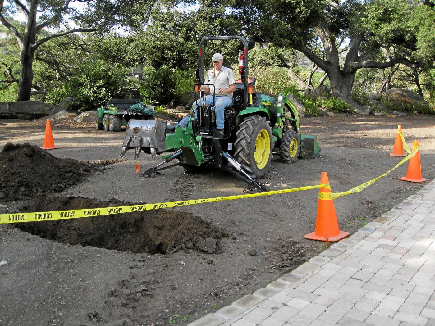 Dave Kershaw digging holes for new oak trees in the Meadow Oaks