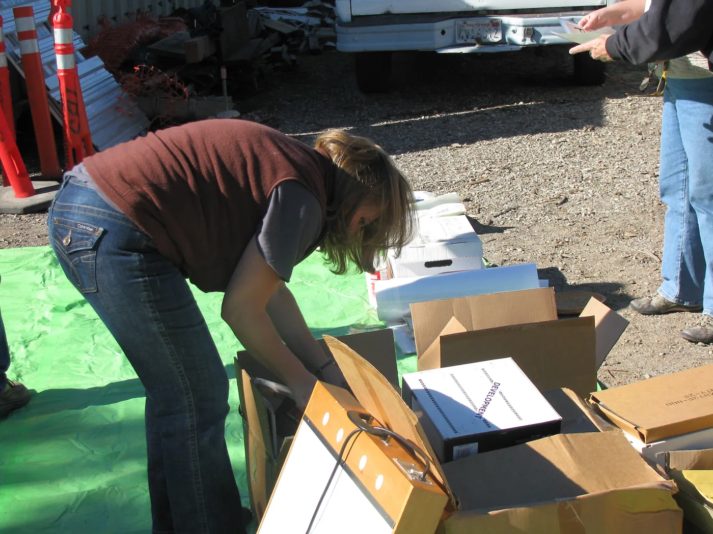 Tricia Wardlaw, SBBG Staff cleaning out temoporary storage container, after the Jesusita Fire