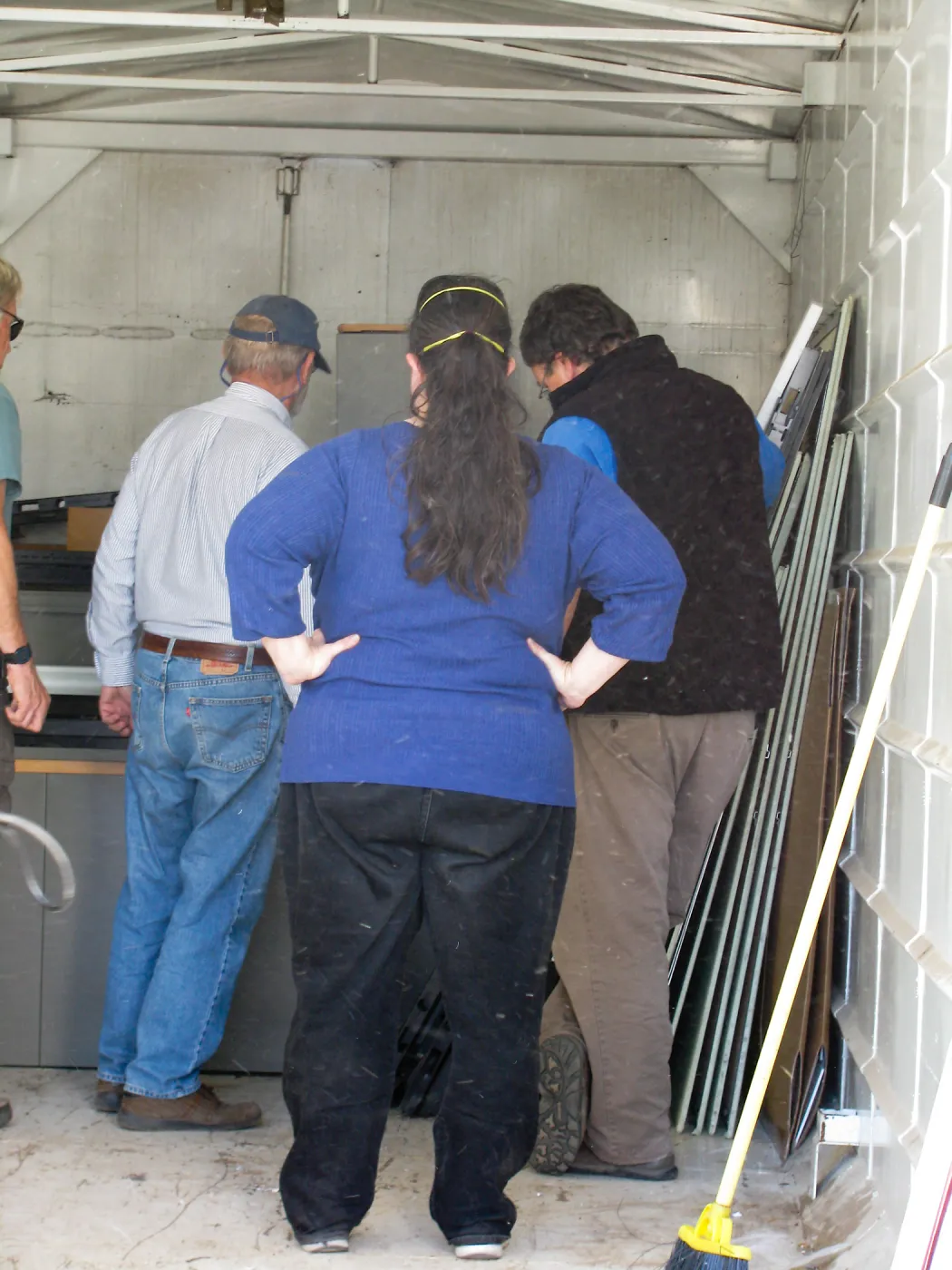 SBBG Staff cleaning out temoporary storage container, after the Jesusita Fire
