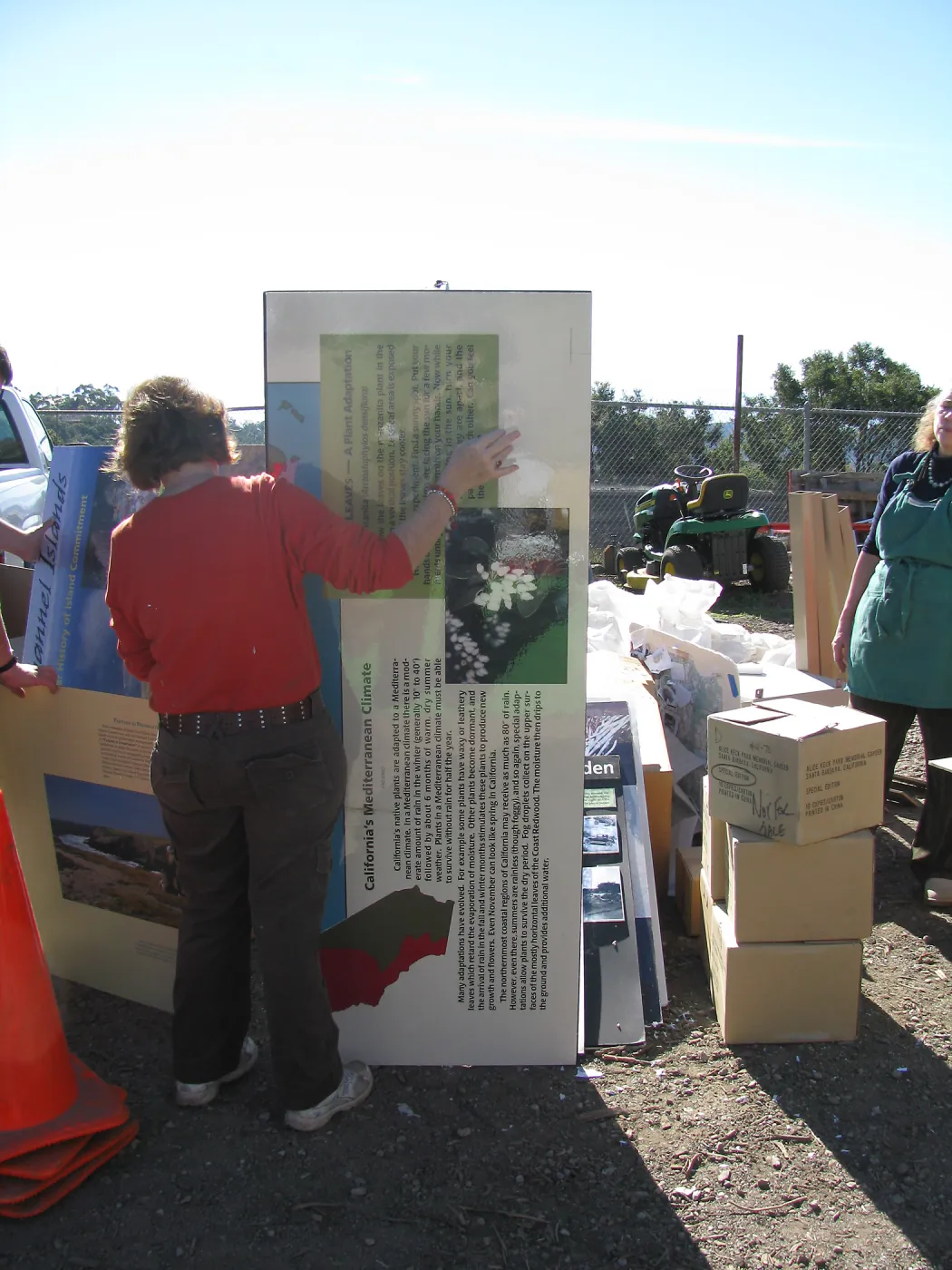 SBBG Staff cleaning out temoporary storage container, after the Jesusita Fire