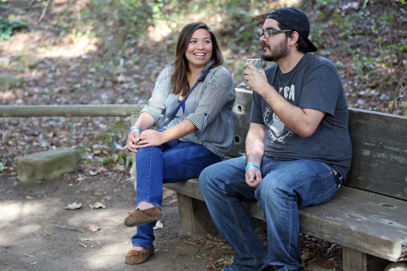 Santa Barbara Beer Garden Event, visitors seated on a wood bench