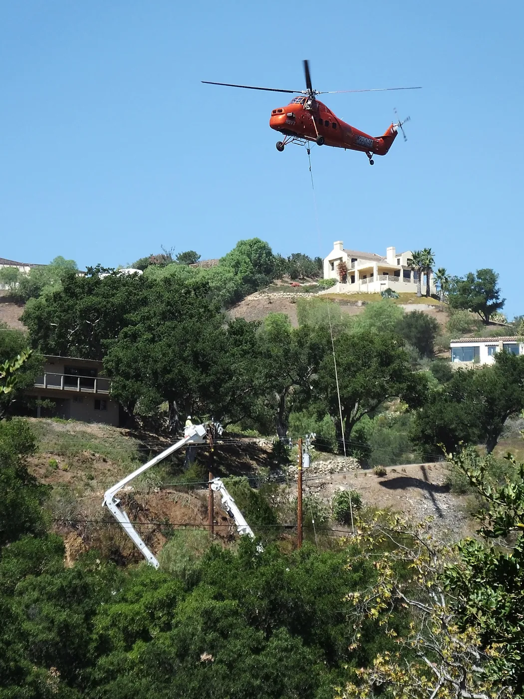 Sikorsky S-58T Screaming Mimi helicopter replacing utility pole in west Mission Canyon