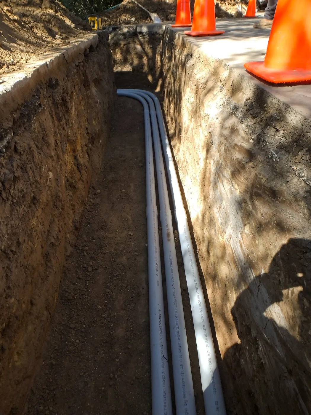 Power and data conduit being installed in the Arroyo Section