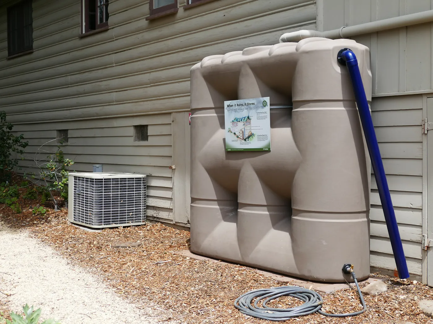 Home Demonstration Garden Renovation, rainwater collection system on west side of Cottage