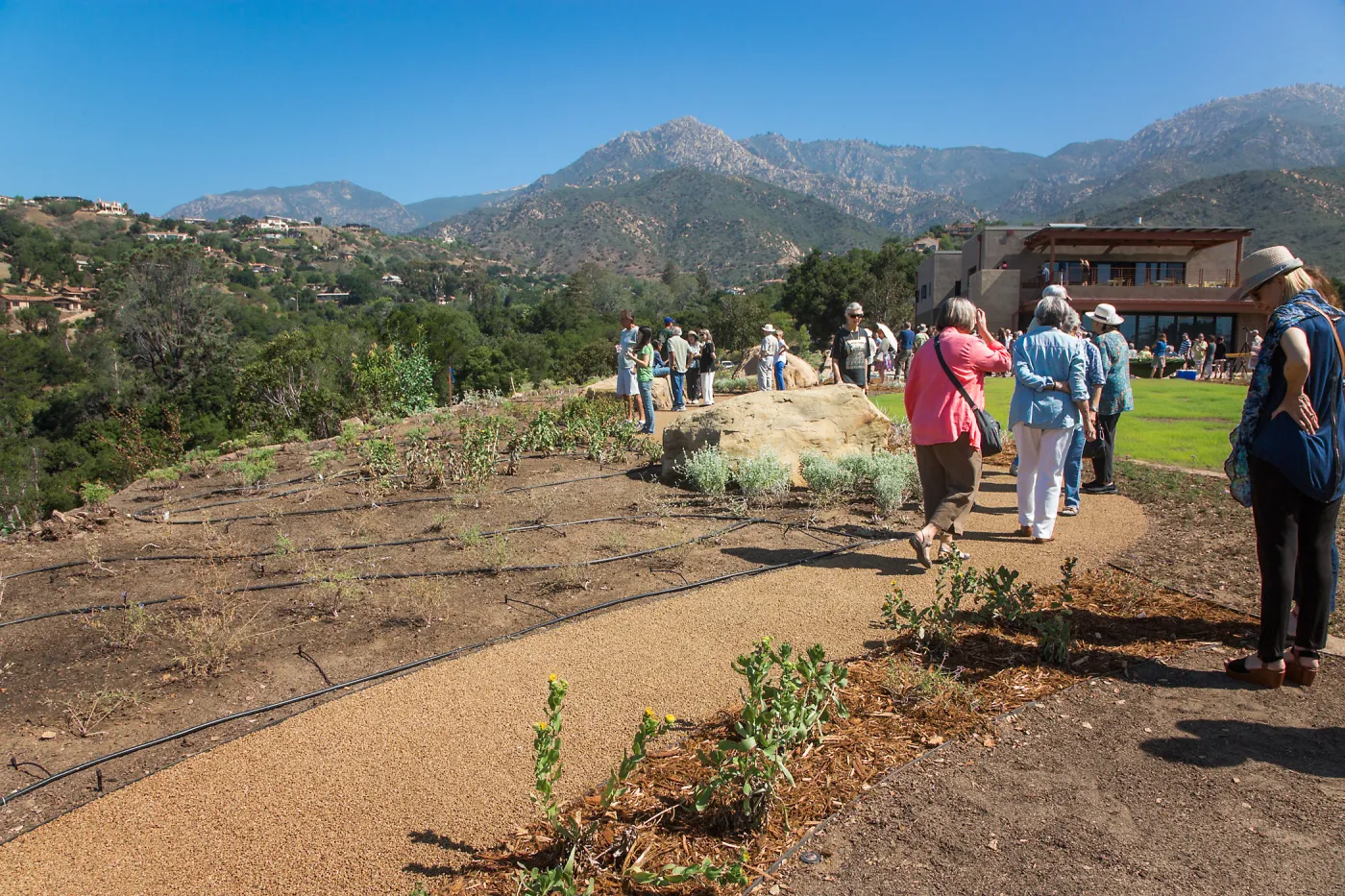 Pritzlaff Conservation Center Ribbon Cutting Celebration, guests exploring the newly planted Island View Garden