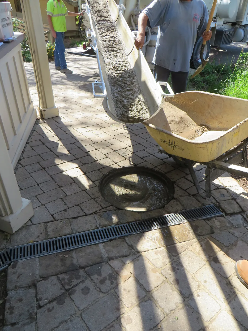 Filling septic tank at entrance with cement slurry