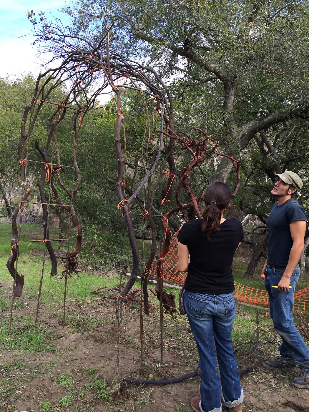 Adam Kuster and Betsy Lape constructing arch for the Centennial Maze