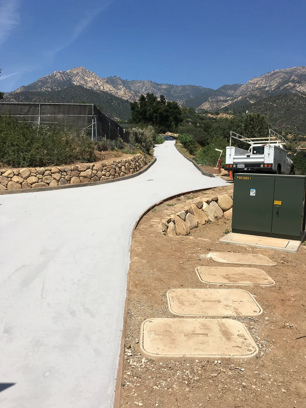 Light colored ecosealant on driveway heading to Pritzlaff Conservation Center