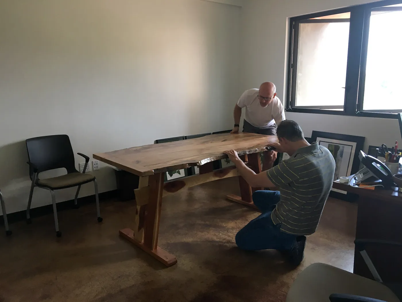 Steve Windhager and Sven Nebelung with new table for director's office