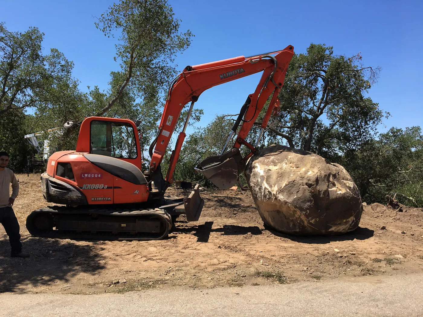 Boulder at Hansen site moved prior to Horticulture Barn construction