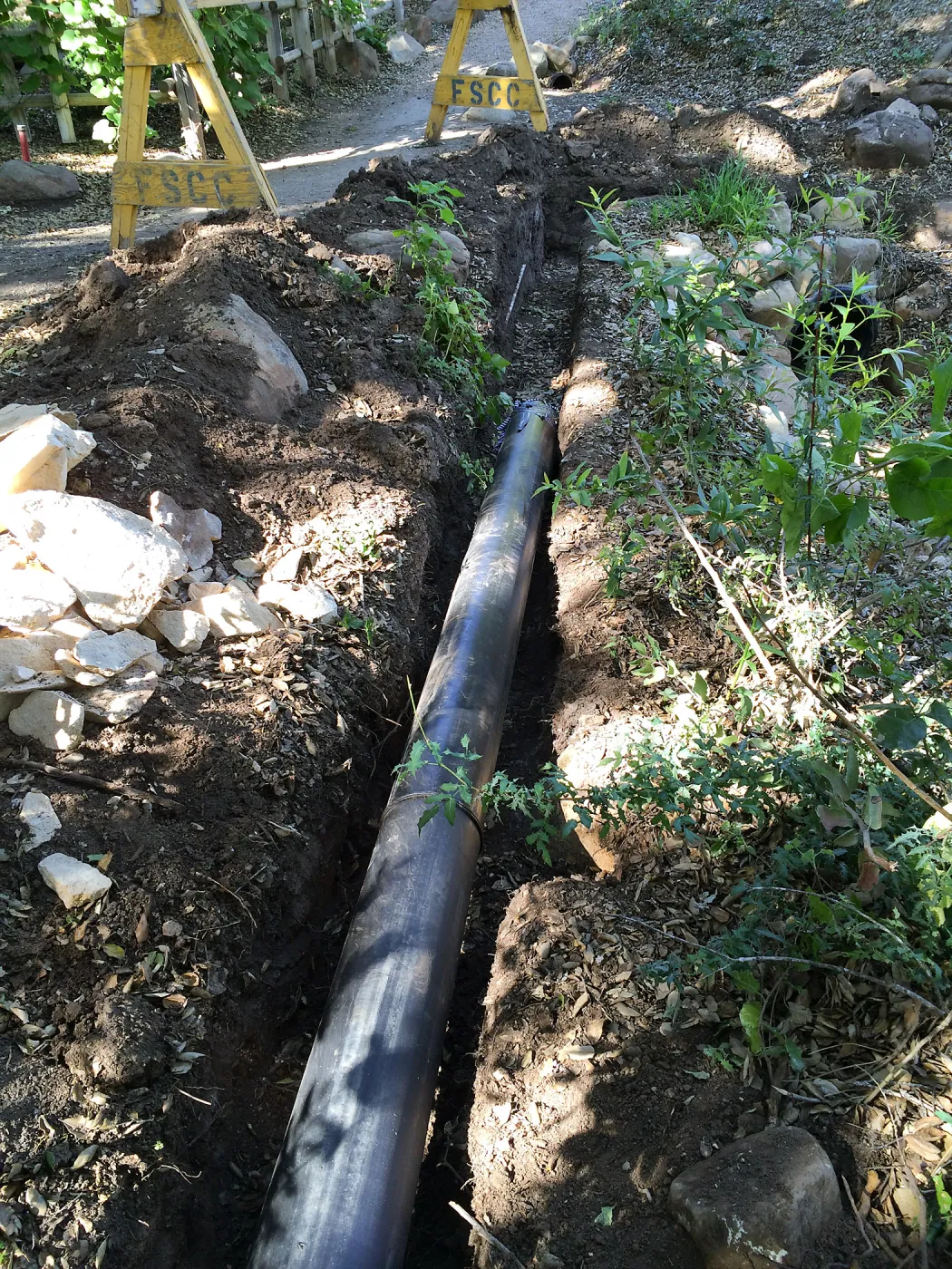 Installation of runoff collection pipe connection from Pritzlaff Conservation Center to well tank