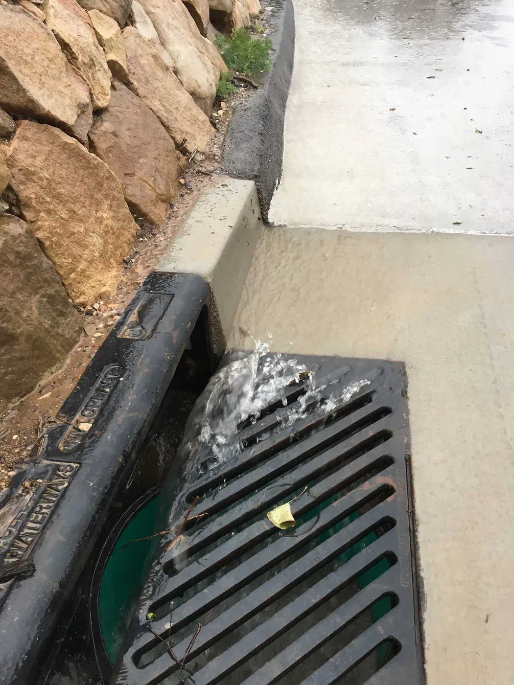 Drain on driveway that funnels water to rill at the Pritzlaff Conservation Center