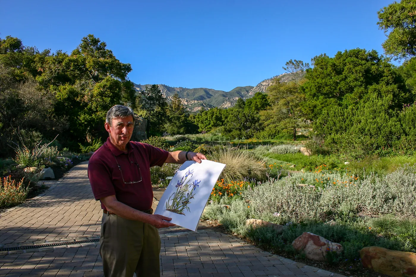 Patick O'Hara with his painting â€œIris and Lilyâ€