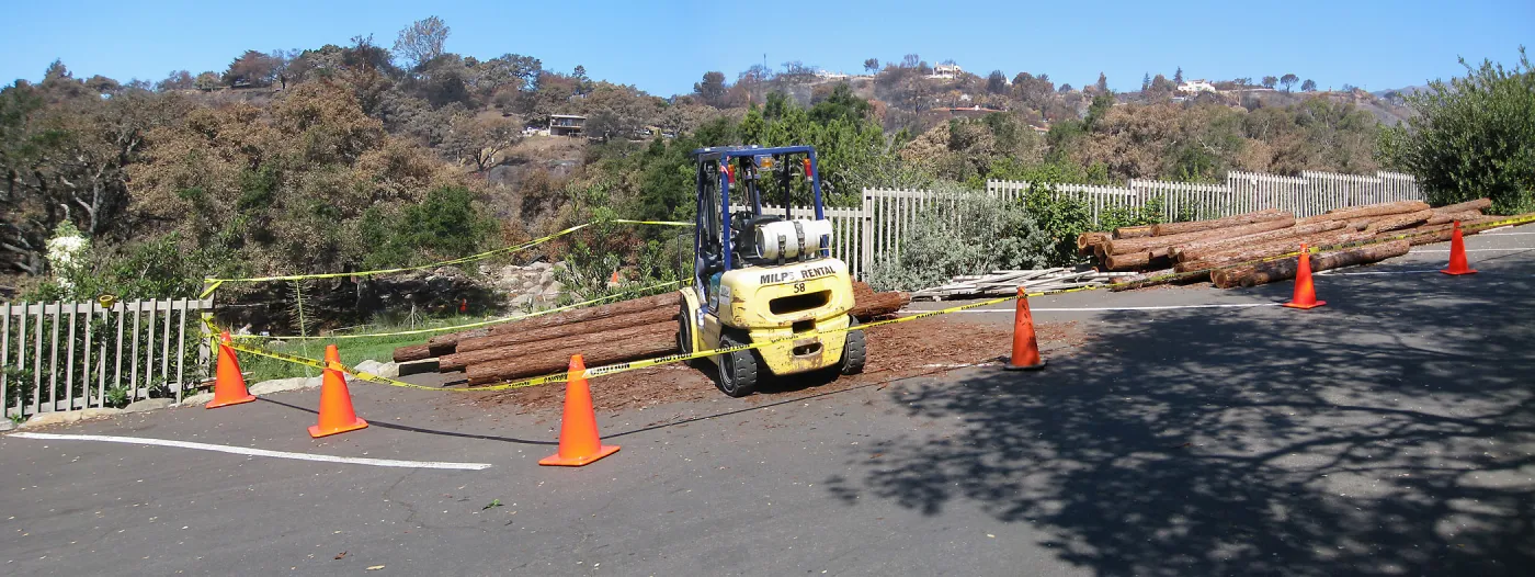 Construction of Herb Parker's â€˜Haven' labyrinth, redwood logs from Restoration Forest Project in main parking lot