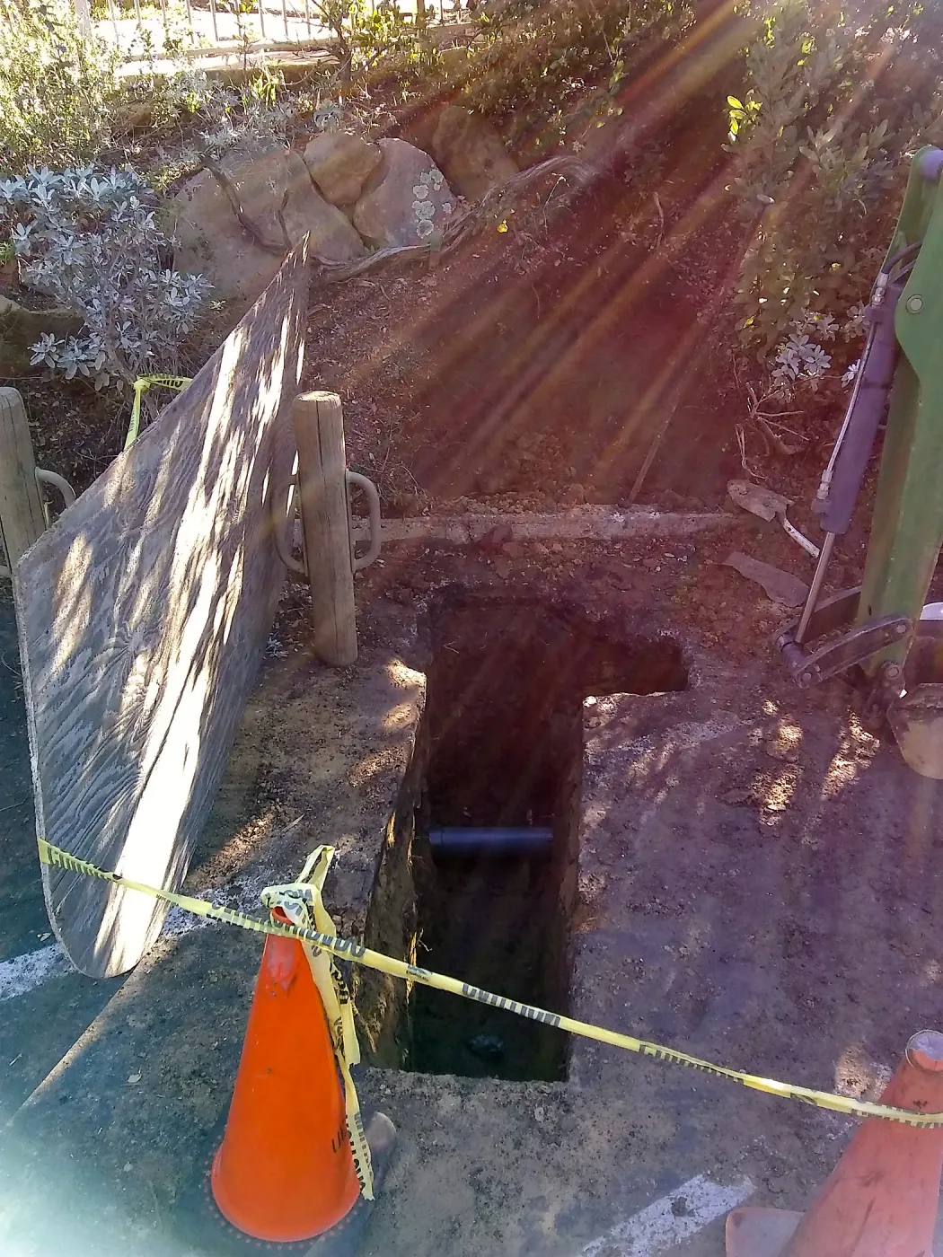 Irrigation water line repair in main parking lot, just south of the bike rack, looking east