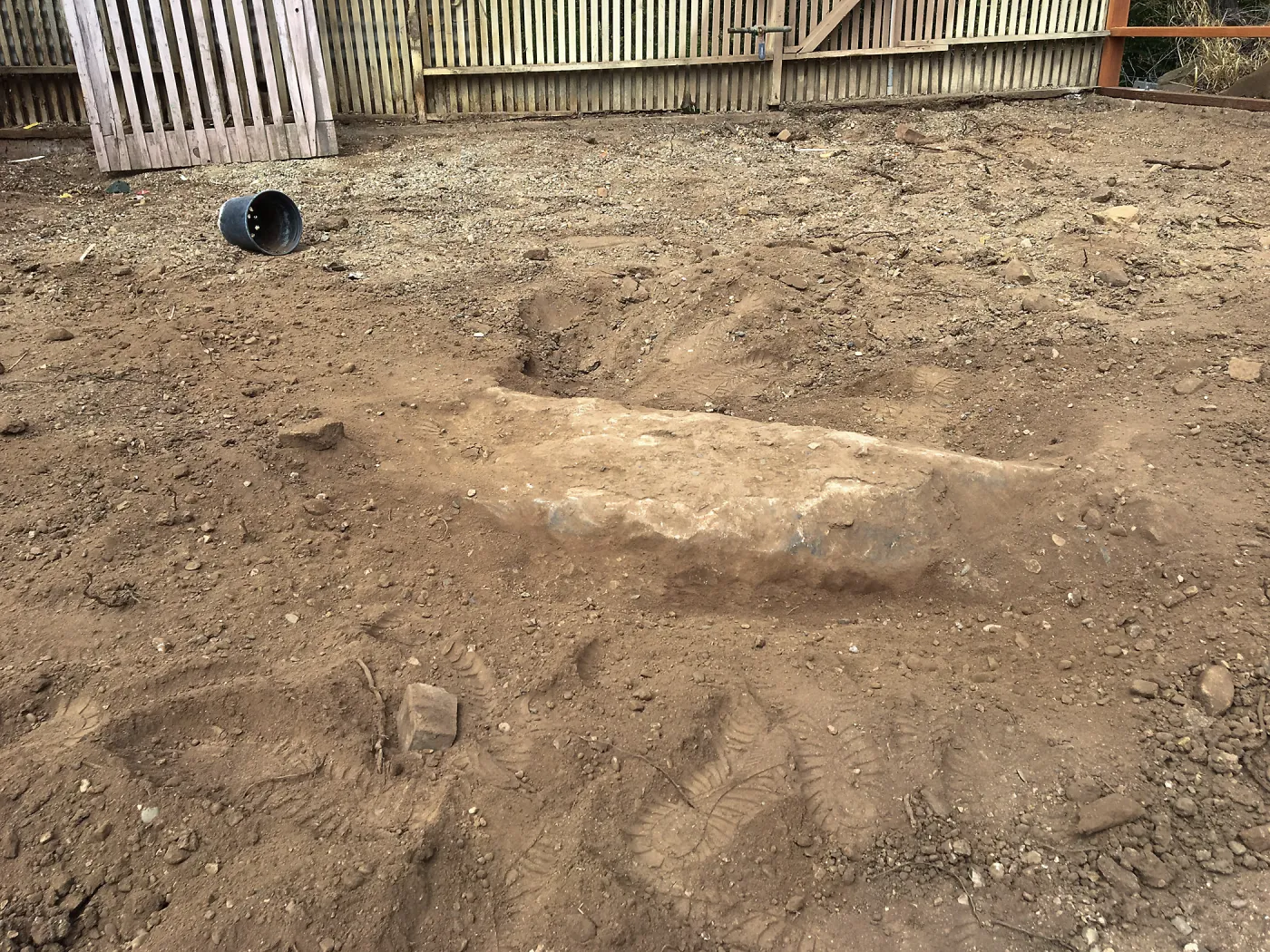 Repair of Garden Growers Lath House. Boulders to remove, looking west