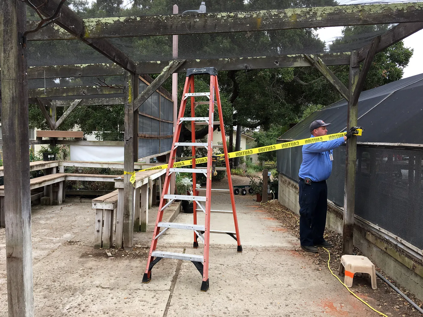 Repair of Garden Growers shade structure, looking south