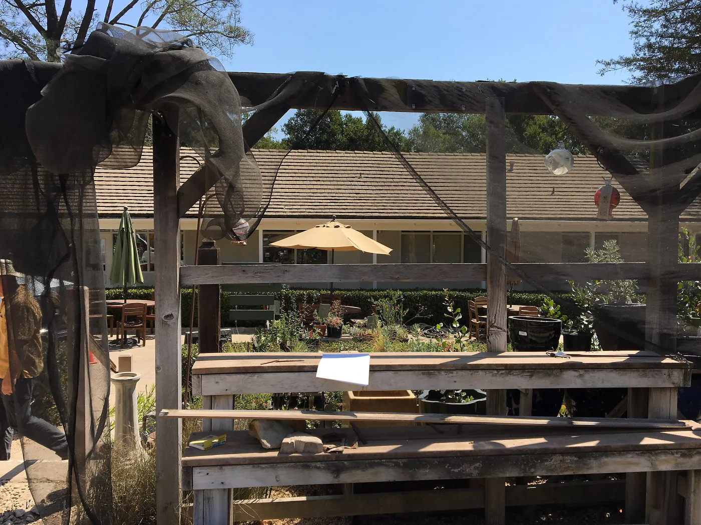 Repair of Garden Growers shade structure, looking east