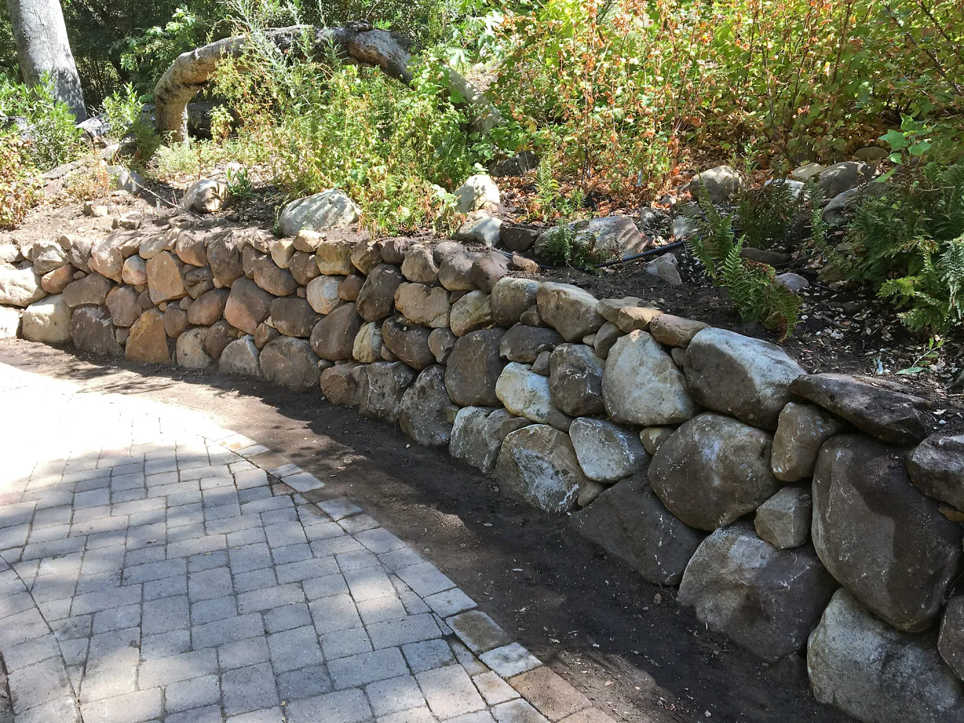 Rebuilt rock wall by Campbell Bridge