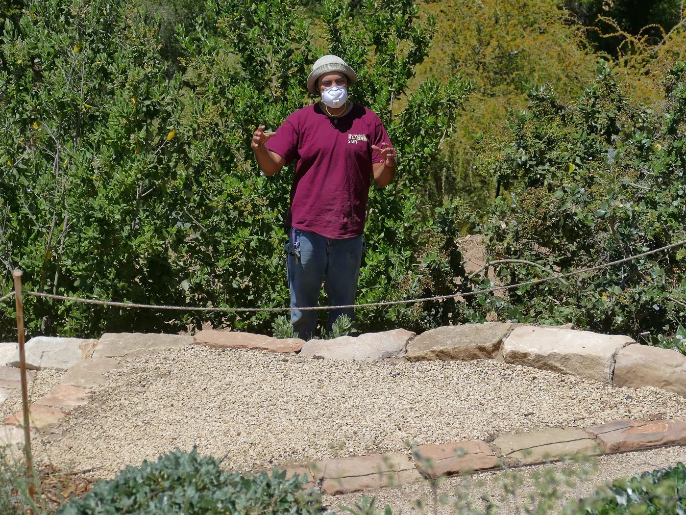 Jacob Cobian at the ribbon cutting for the opening of the new stone staircase in the Island Transect Display he built by hand.