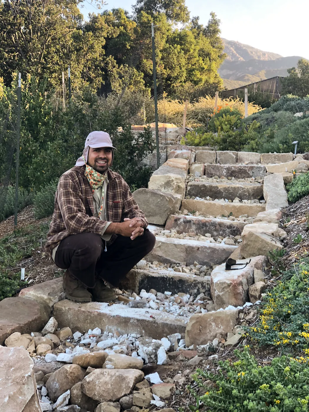 Jacob Cobian at the completion of a new rock staircase on the west side of the PCC. Built entirely by hand out of sandstone from Montecito landslide materials. Side blocks all hand cut and stacked. Filled with crushed stone, layered with soil and gravel.