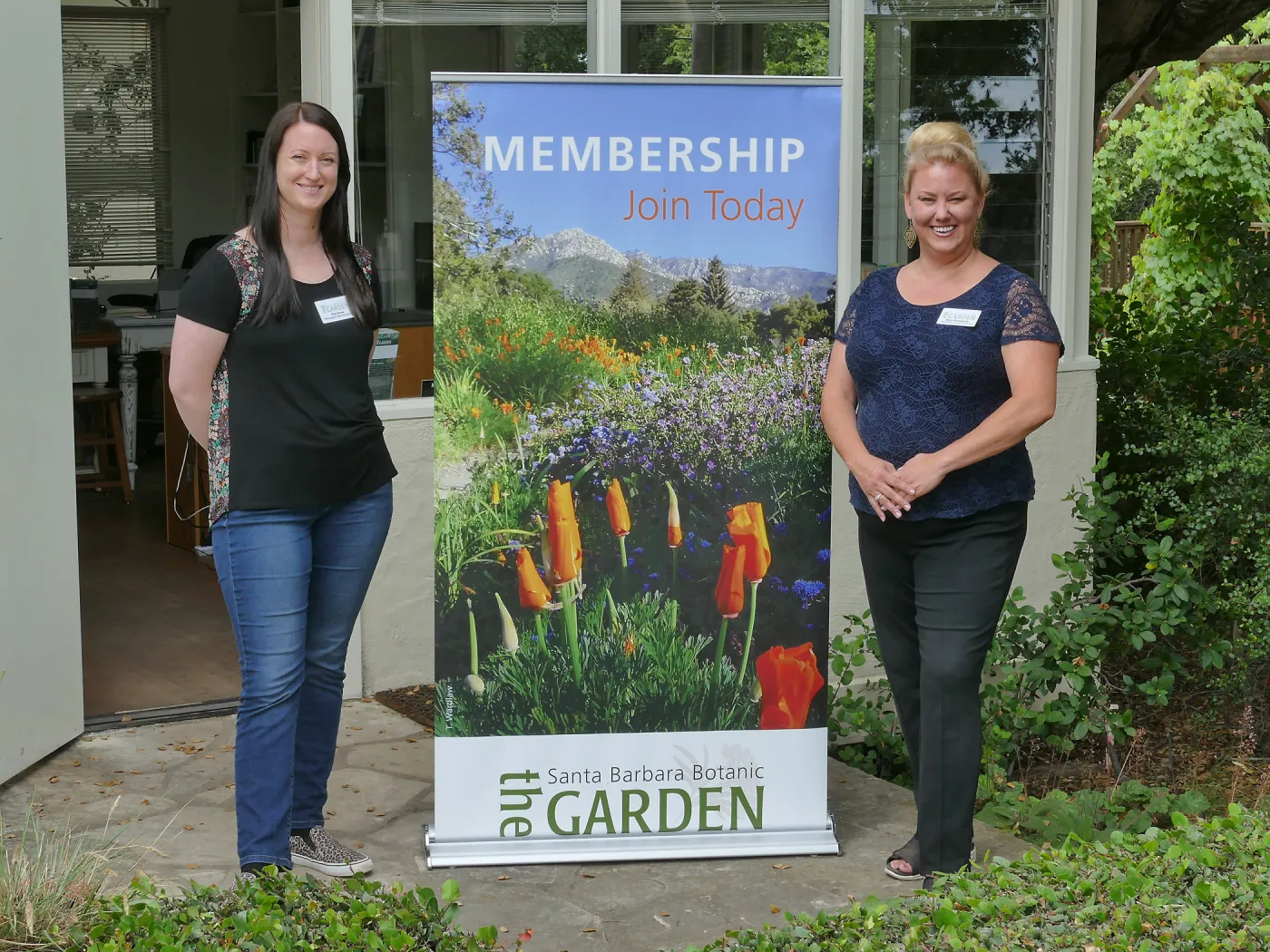 Rita Boss and Stacy Bloodworth with a new membership display banner