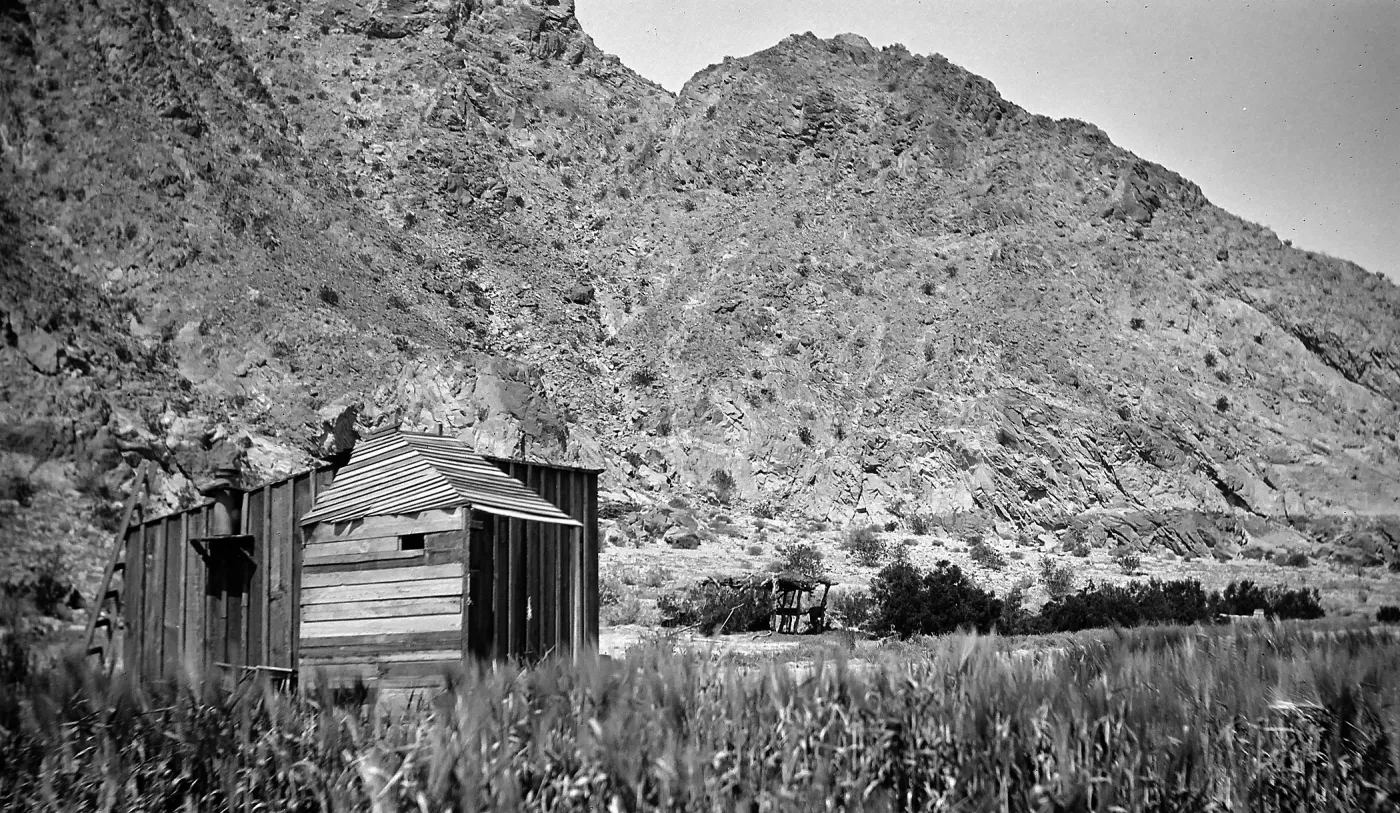 Indio, shack next to mountain