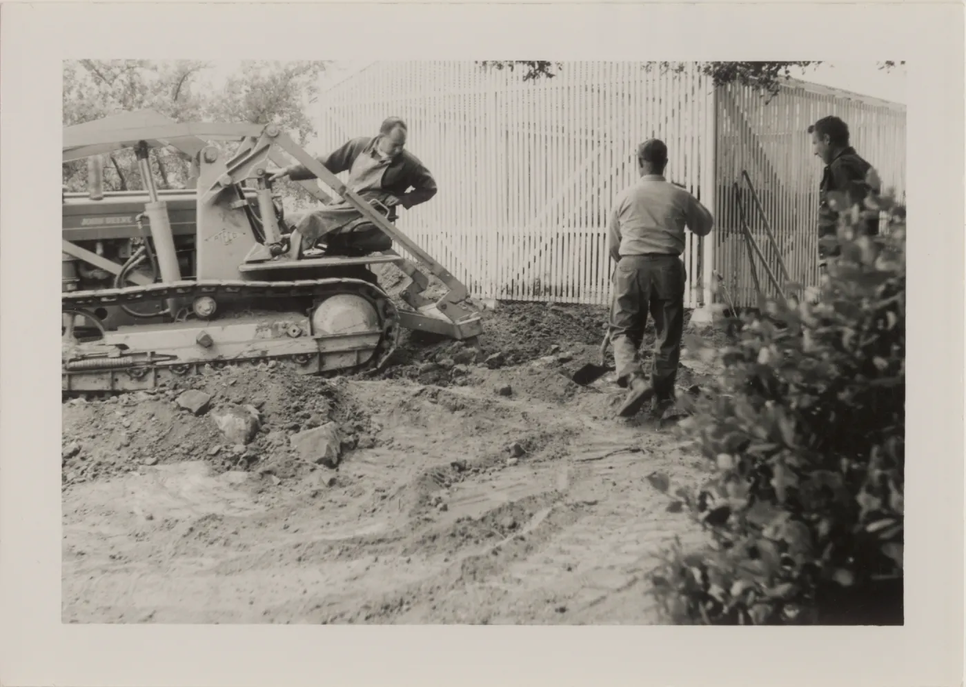 Breaking ground with tractor, Carl, Joe, Jim